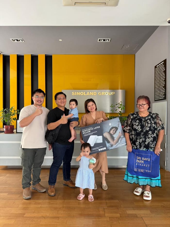 Denny with a family at a property handover